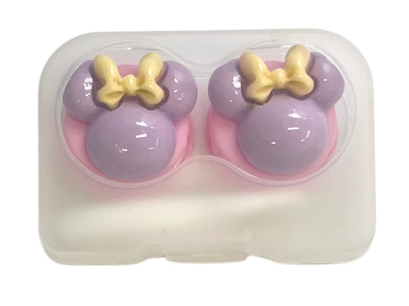 Minnie-hahmon piilolinssien säilytyssetti, väri: vaaleanpunainen pohja, violetti, keltainen rusetti.